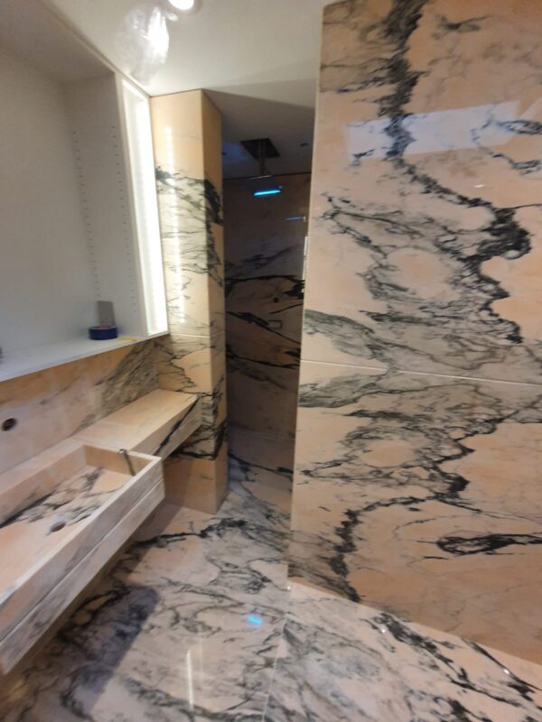 ROSA PORTUGAL MARBLE BESPOKE BATHROOM BOOKMATCHED WALLS FLOOR INSTALLATION